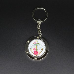 Porte sac - porte clefs avec ancre fleuri fond blanc